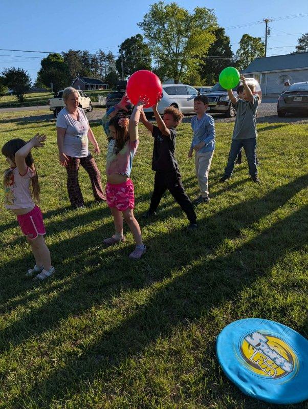 Kids with balloons outdoors